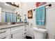 Modern bathroom with white cabinets, granite counters, and brushed black hardware, offers a clean and updated space at 2935 Antique Oaks Cir # 64, Winter Park, FL 32792
