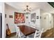 Dining area with a large table, complemented by stylish decor and an open view to the kitchen at 2935 Antique Oaks Cir # 64, Winter Park, FL 32792
