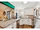 Bright kitchen featuring stainless steel appliances, granite countertops, and a modern faucet at 2935 Antique Oaks Cir # 64, Winter Park, FL 32792