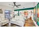 Bright living room open to the kitchen and dining area, featuring stylish furnishings and a sliding glass door at 2935 Antique Oaks Cir # 64, Winter Park, FL 32792