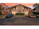 Exterior view of condo building with dedicated parking and lush landscaping at 2935 Antique Oaks Cir # 64, Winter Park, FL 32792
