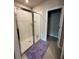 Bathroom featuring a glass-enclosed shower and tile flooring at 3072 Cassidy Ln, Haines City, FL 33844