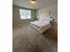 Bedroom with a neutral color palette, carpet flooring, and bright natural light at 3072 Cassidy Ln, Haines City, FL 33844