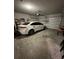 Spacious garage featuring a white car and ample storage space, perfect for parking and organization at 3072 Cassidy Ln, Haines City, FL 33844