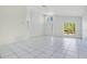 Inviting living room with tile flooring, neutral walls, and large windows provides plenty of natural light at 441 Tree Shore Dr, Orlando, FL 32825