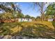 Spacious backyard with grassy lawn and wooden fence at 4722 Halliday Ln, Orlando, FL 32810