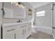 Modern bathroom with white vanity, marble shower, and updated fixtures at 4722 Halliday Ln, Orlando, FL 32810