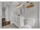 Clean bathroom with white vanity, mirror, and updated fixtures at 4722 Halliday Ln, Orlando, FL 32810