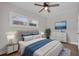 Spacious bedroom with a queen bed, dresser and large windows at 4722 Halliday Ln, Orlando, FL 32810