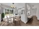 Kitchen and dining area with white cabinets and a center island at 4722 Halliday Ln, Orlando, FL 32810