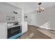 Modern blue oven, white cabinets, and quartz countertops at 4722 Halliday Ln, Orlando, FL 32810