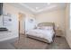 Comfortable bedroom with neutral walls, large bed, bedside tables and an area rug at 4731 Clock Tower Dr # 401, Kissimmee, FL 34746