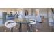 Bright, open-concept living space with modern furnishings and a sleek dining area at 4731 Clock Tower Dr # 401, Kissimmee, FL 34746