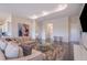 Inviting living room featuring a plush sofa, stylish artwork, and ample natural light at 4731 Clock Tower Dr # 401, Kissimmee, FL 34746