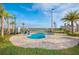 Community spa overlooks the adjacent lake, offering a serene and accessible relaxation space at 4731 Clock Tower Dr # 401, Kissimmee, FL 34746