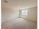 Spacious bedroom featuring neutral carpet, natural light from window and neutral paint at 5108 Rain Shadow Dr, St Cloud, FL 34772