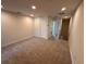 Neutral colored room with carpet, a closet, recessed lights, and access to the upper level at 5108 Rain Shadow Dr, St Cloud, FL 34772