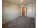 Bedroom featuring carpet flooring, a closet and a view into the hallway at 5108 Rain Shadow Dr, St Cloud, FL 34772