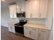 The modern kitchen features white cabinets, stainless steel appliances, and a subway tile backsplash at 5108 Rain Shadow Dr, St Cloud, FL 34772