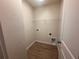 Small laundry room featuring white shelving and neutral paint at 5108 Rain Shadow Dr, St Cloud, FL 34772