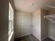 Carpeted walk-in closet with white shelving and storage racks and a window for natural light at 5108 Rain Shadow Dr, St Cloud, FL 34772