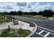 Aerial view of a community entrance with roads and landscaping at 5306 Center Lake Ranch Blvd, St Cloud, FL 34771