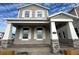 Two-story home with gray siding, stone accents, and a covered porch at 5306 Center Lake Ranch Blvd, St Cloud, FL 34771