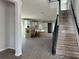 View of an entryway with stairs leading upstairs and boxes indicating new construction at 5306 Center Lake Ranch Blvd, St Cloud, FL 34771