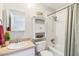 Bathroom featuring a single sink vanity, mirror, and a tub with shower at 5413 Hansel Ave # K10, Orlando, FL 32809