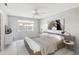 Cozy bedroom with ceiling fan, streamlined furniture, large window and ample natural light at 5413 Hansel Ave # K10, Orlando, FL 32809