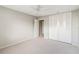 Comfortable bedroom with carpet and closet, a ceiling fan, and closet space, ideal for relaxation and storage at 5413 Hansel Ave # K10, Orlando, FL 32809
