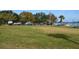 Expansive lawn area dedicated to boat parking, with lake access and lush greenery at 5413 Hansel Ave # K10, Orlando, FL 32809