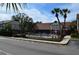 Inviting community pool area surrounded by attractive buildings and well-maintained landscaping at 5413 Hansel Ave # K10, Orlando, FL 32809