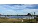 Scenic lakefront view with lush green grassy area at 5413 Hansel Ave # K10, Orlando, FL 32809