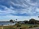 Peaceful lake view with tennis courts and grassy area at 5413 Hansel Ave # K10, Orlando, FL 32809