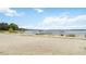 Lakefront with a sandy beach area where multiple boats are docked at 5413 Hansel Ave # K10, Orlando, FL 32809