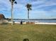 Lakefront picnic area with grills and palm trees at 5413 Hansel Ave # K10, Orlando, FL 32809