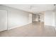 Empty living room with tile floor, ceiling fan, closet and doorway to other rooms in neutral color at 5413 Hansel Ave # K10, Orlando, FL 32809