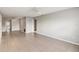 Spacious empty living room with tile floors and ceiling fan, providing a bright and airy feel at 5413 Hansel Ave # K10, Orlando, FL 32809