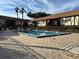 Inviting community pool with lounge chairs at 5413 Hansel Ave # K10, Orlando, FL 32809