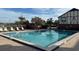Refreshing community pool with lounge chairs at 5413 Hansel Ave # K10, Orlando, FL 32809