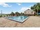 Community swimming pool surrounded by lounge chairs for residents' relaxation and enjoyment at 5413 Hansel Ave # K10, Orlando, FL 32809