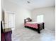 Bright bedroom with a double bed and marble floors at 5633 Piney Ridge Dr, Orlando, FL 32808
