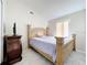 Bedroom with a queen-size bed and marble floors at 5633 Piney Ridge Dr, Orlando, FL 32808