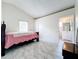 Bedroom with pink bedspread and access to bathroom at 5633 Piney Ridge Dr, Orlando, FL 32808
