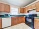 Kitchen with wood cabinets, stainless steel appliances, and tiled floors at 5633 Piney Ridge Dr, Orlando, FL 32808