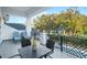 Spacious balcony overlooking mature landscaping and a community pool at 7017 Via Carmel Way, Orlando, FL 32819
