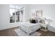 Bright bedroom with a large window, wood floors, and a neutral color palette at 7017 Via Carmel Way, Orlando, FL 32819