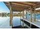 Scenic view from the covered boat dock with boat lift and calm water at 7017 Via Carmel Way, Orlando, FL 32819