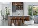 Stylish kitchen with bar seating, modern appliances, and outdoor views perfect for entertaining at 7017 Via Carmel Way, Orlando, FL 32819